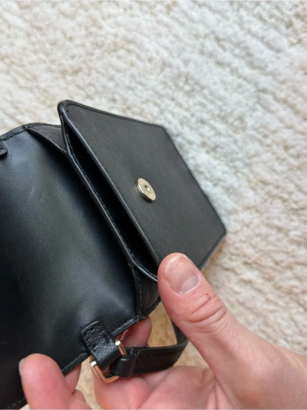 kate spade black leather crossbody phone pouch with gold logo